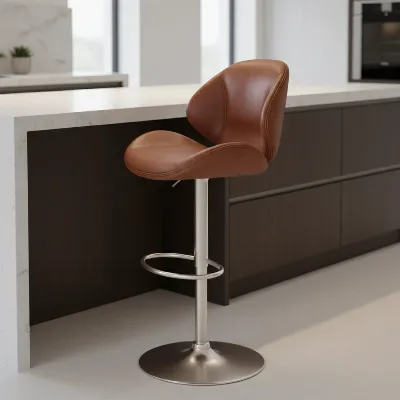 Ergonomic leather bar stool with backrest and footrest in a modern kitchen setting