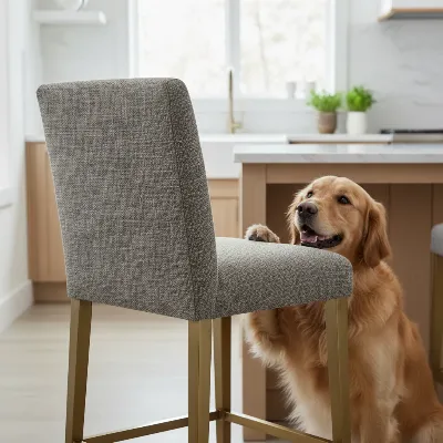 Durable upholstered bar stool in a modern kitchen with a playful dog nearby.